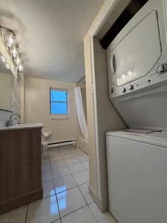 a view of a livingroom with washer and dryer