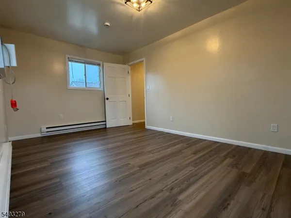 a view of a livingroom with wooden floor