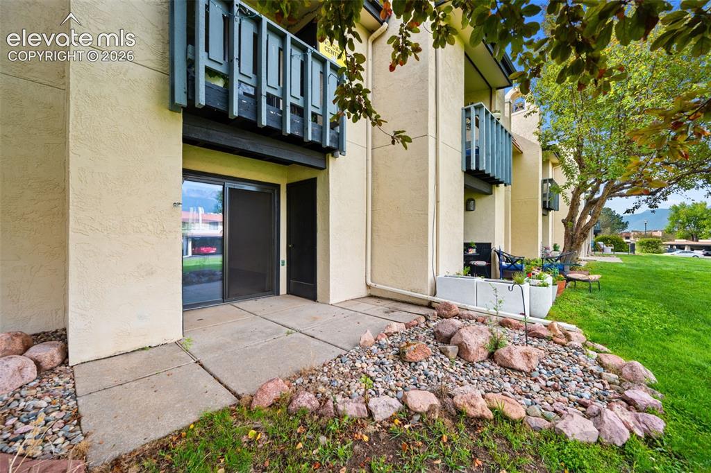 1018 Fontmore Road, Unit A Colorado Springs, CO 80904 - Photo 21 of 28 a front view of a building with a garden