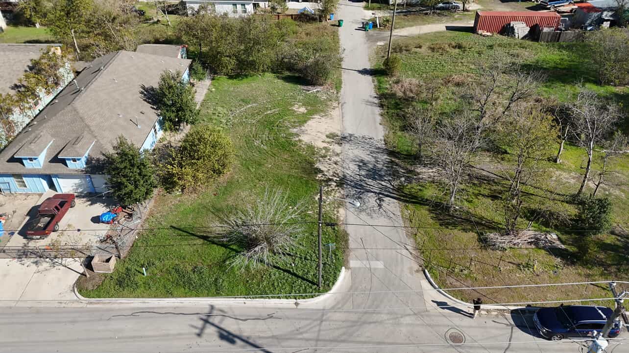 110 North Robinson Street Taylor, TX 76574 - Photo 2 of 6 an aerial view of a house with a yard and plants