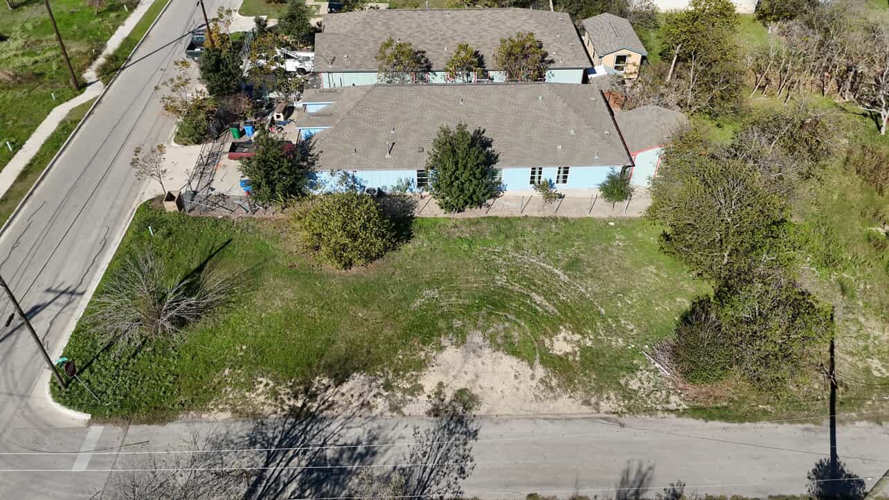110 North Robinson Street Taylor, TX 76574 - Photo 5 of 6 an aerial view of a house with a yard
