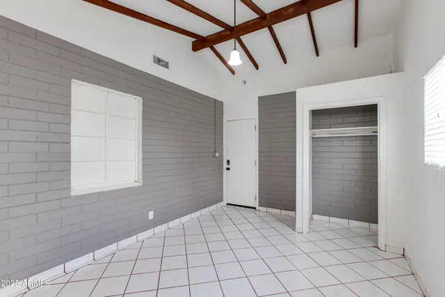 a bathroom with a granite countertop sink toilet and bathtub