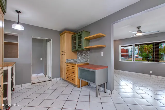 a kitchen with granite countertop a stove and a sink