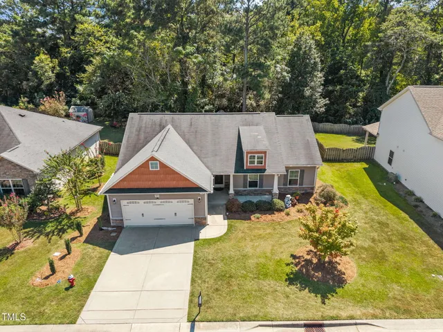 an aerial view of a house with swimming pool