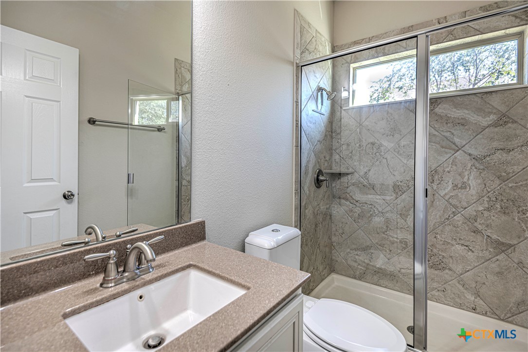 9207 Lake Pointe Drive Temple, TX 76502 - Photo 18 of 42 a bathroom with a sink toilet and shower