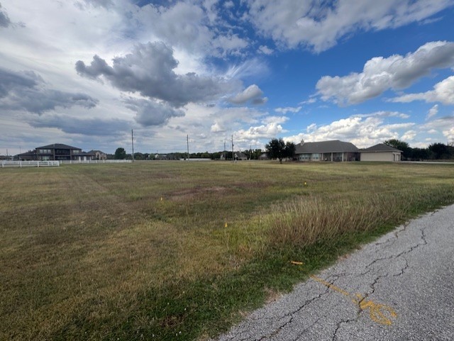 6710 Cartwright Court Rosenberg, TX 77469 - Photo 2 of 4 a view of a lake with a big yard