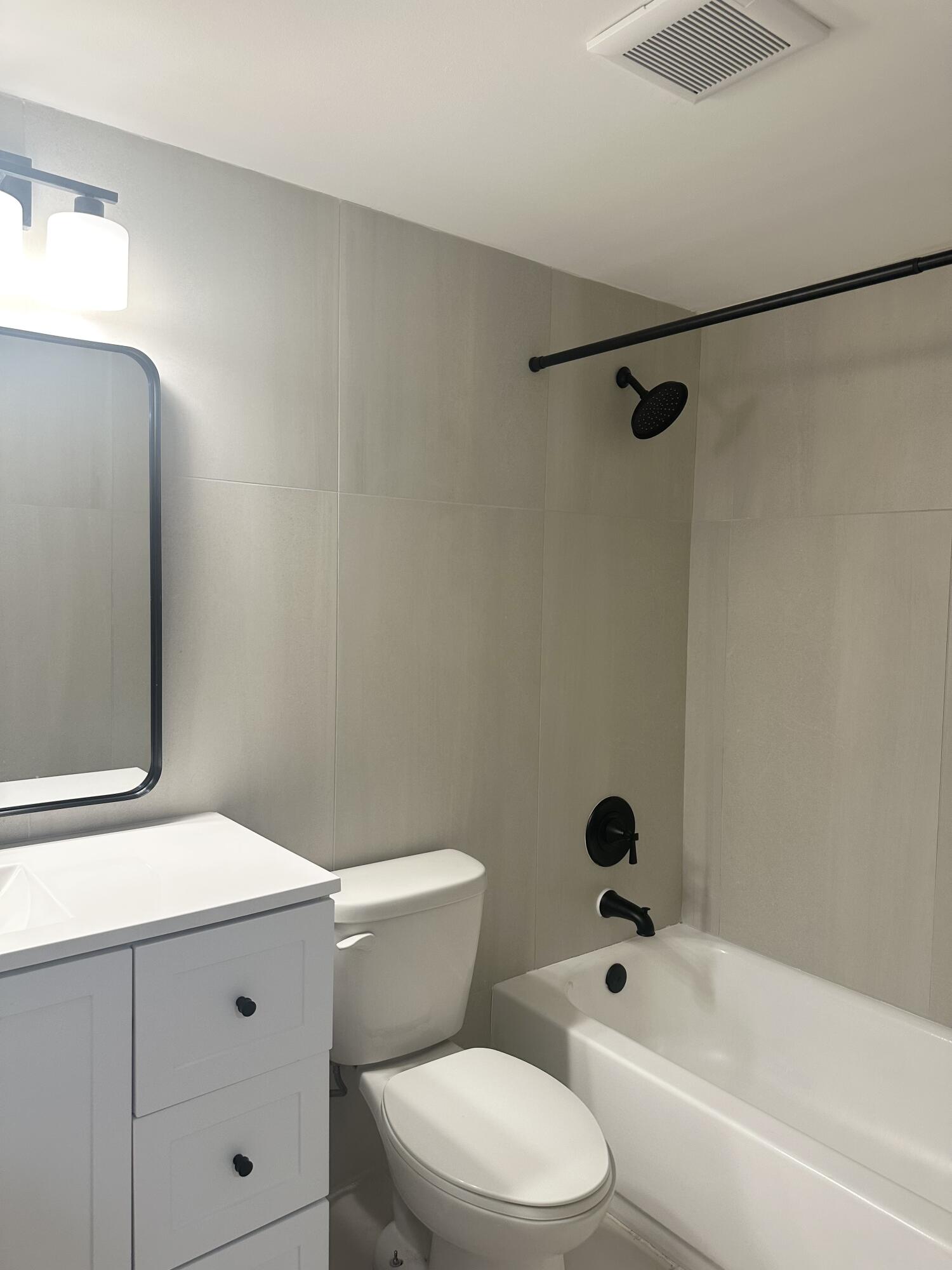 4779 Sable Pine Circle, Unit B2 West Palm Beach, FL 33417 - Photo 20 of 21 a bathroom with a toilet a sink and a bathtub