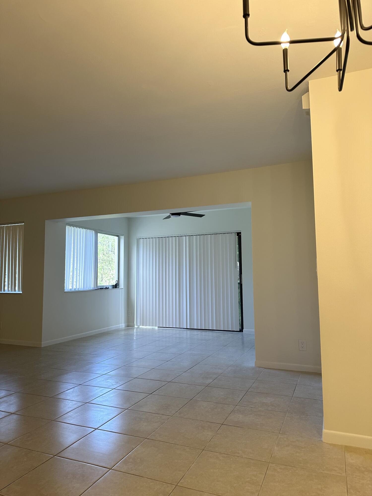 4779 Sable Pine Circle, Unit B2 West Palm Beach, FL 33417 - Photo 6 of 21 a view of a room with an empty space and a window
