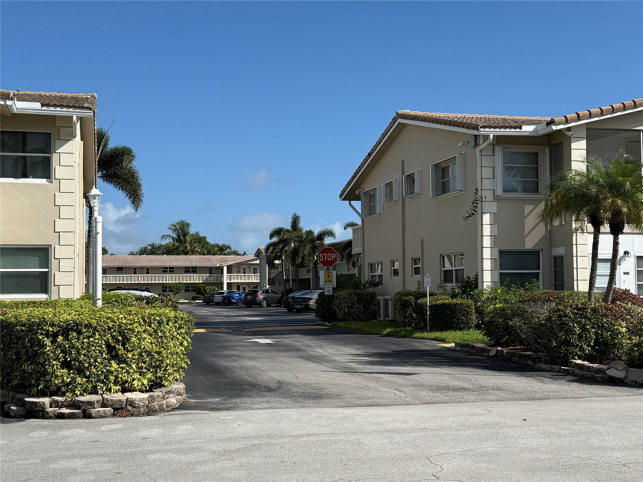 2131 Northeast 42nd Court, Unit 202E Lighthouse Point, FL 33064 - Photo 17 of 23 a view of a house with a street