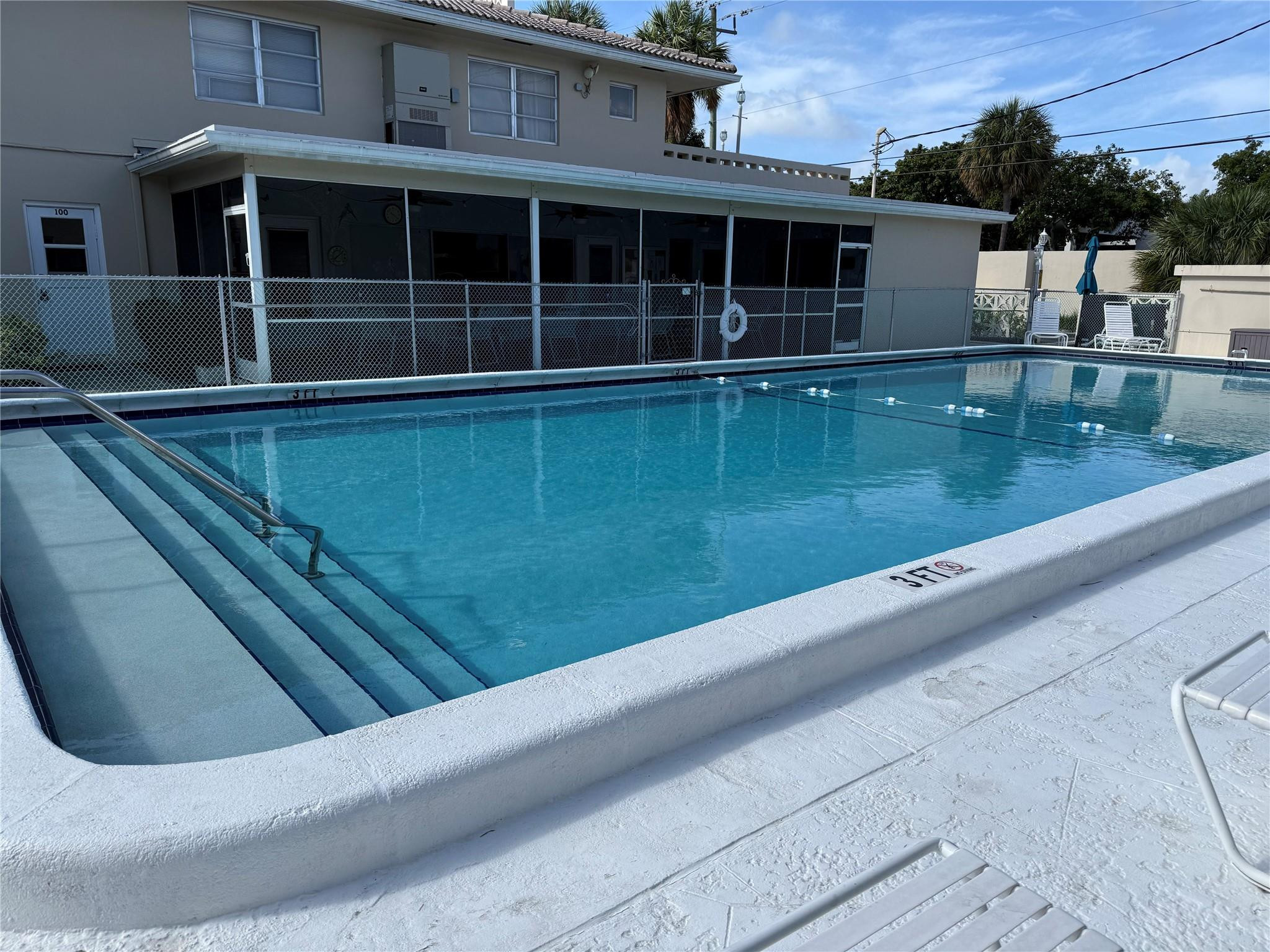 2131 Northeast 42nd Court, Unit 202E Lighthouse Point, FL 33064 - Photo 20 of 23 a view of a house with a swimming pool