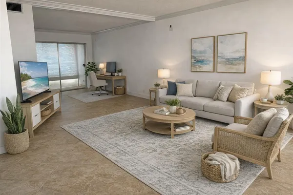 a living room with furniture and a potted plant