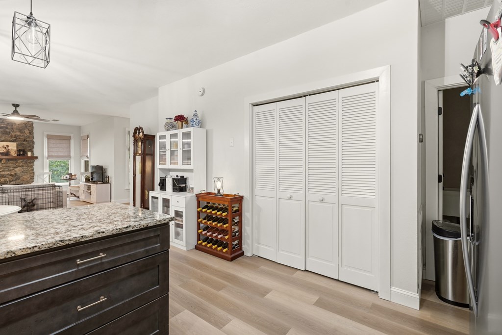 175 Crane Creek Road Young Harris, GA 30582 - Photo 18 of 40 a room with a refrigerator and cabinets