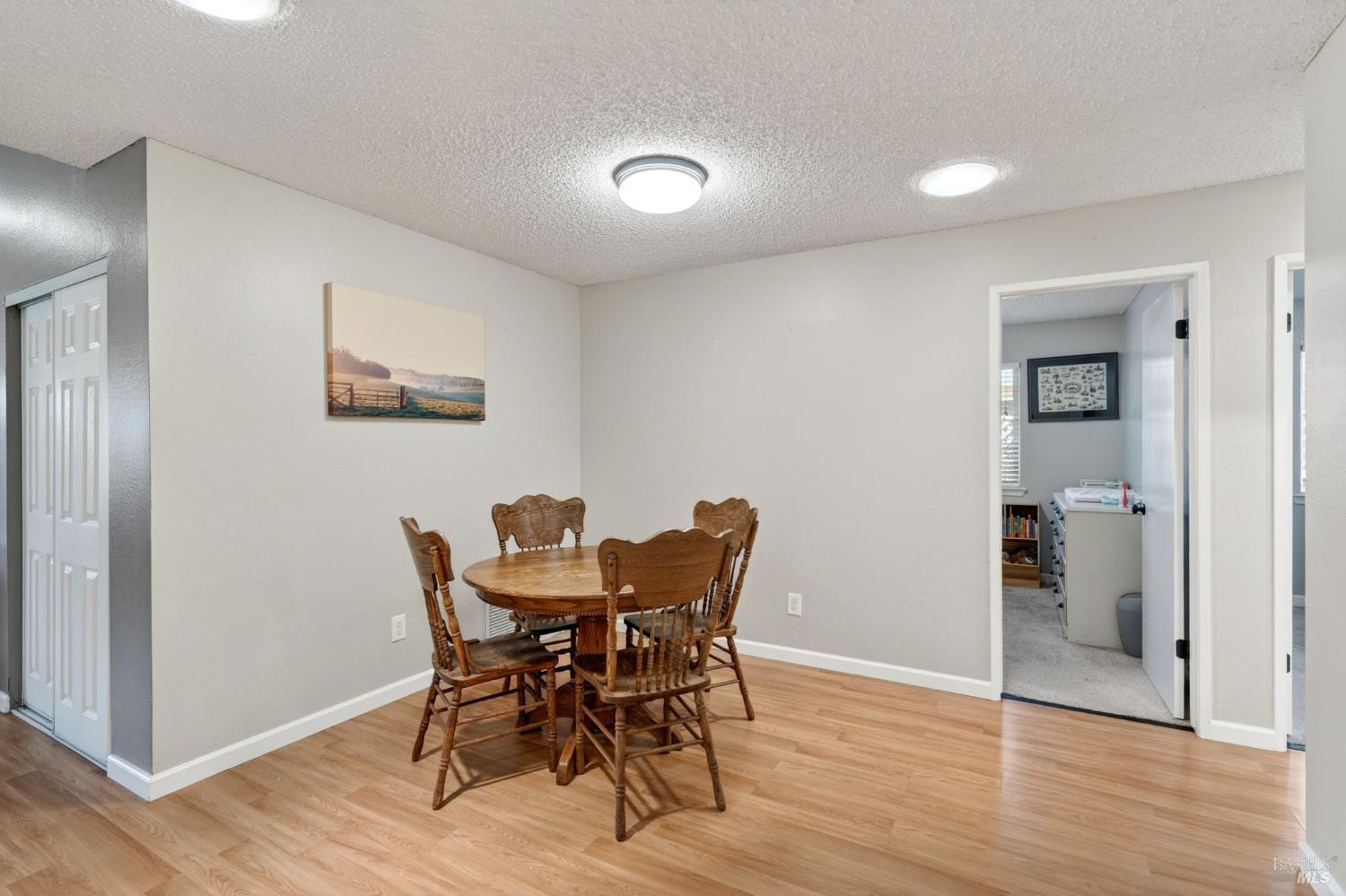4526 Hillview Court Rohnert Park, CA 94928 - Photo 10 of 28 a view of a dining room with furniture and wooden floor