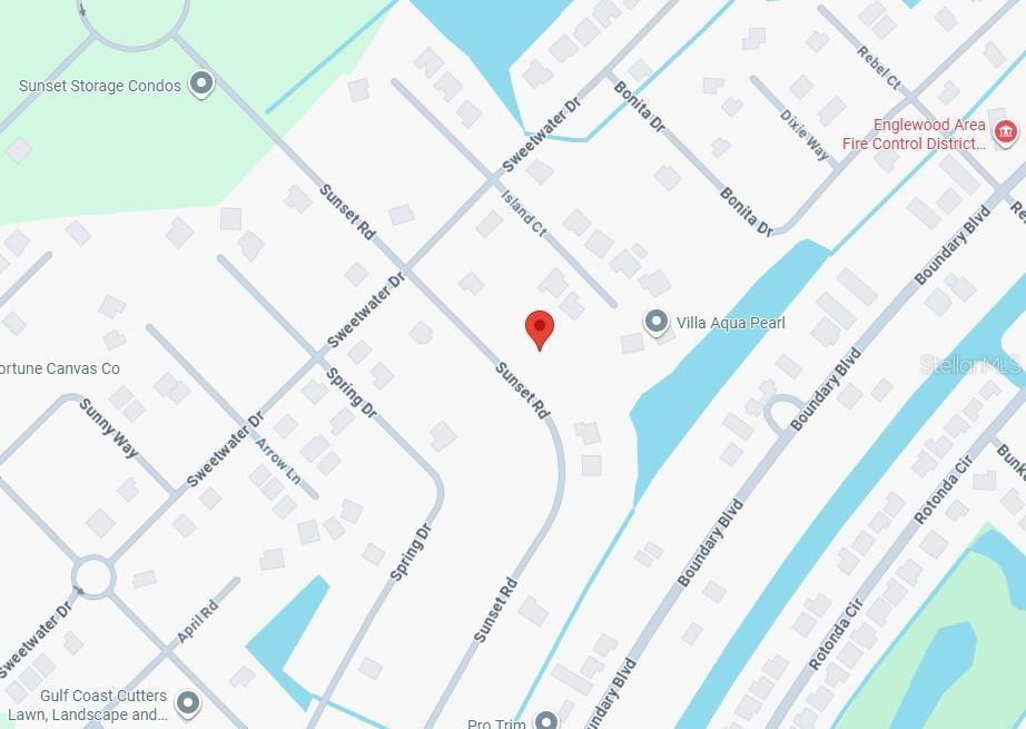 235 Sunset Road Rotonda West, FL 33947 - Photo 4 of 6 a picture of a book in a yard