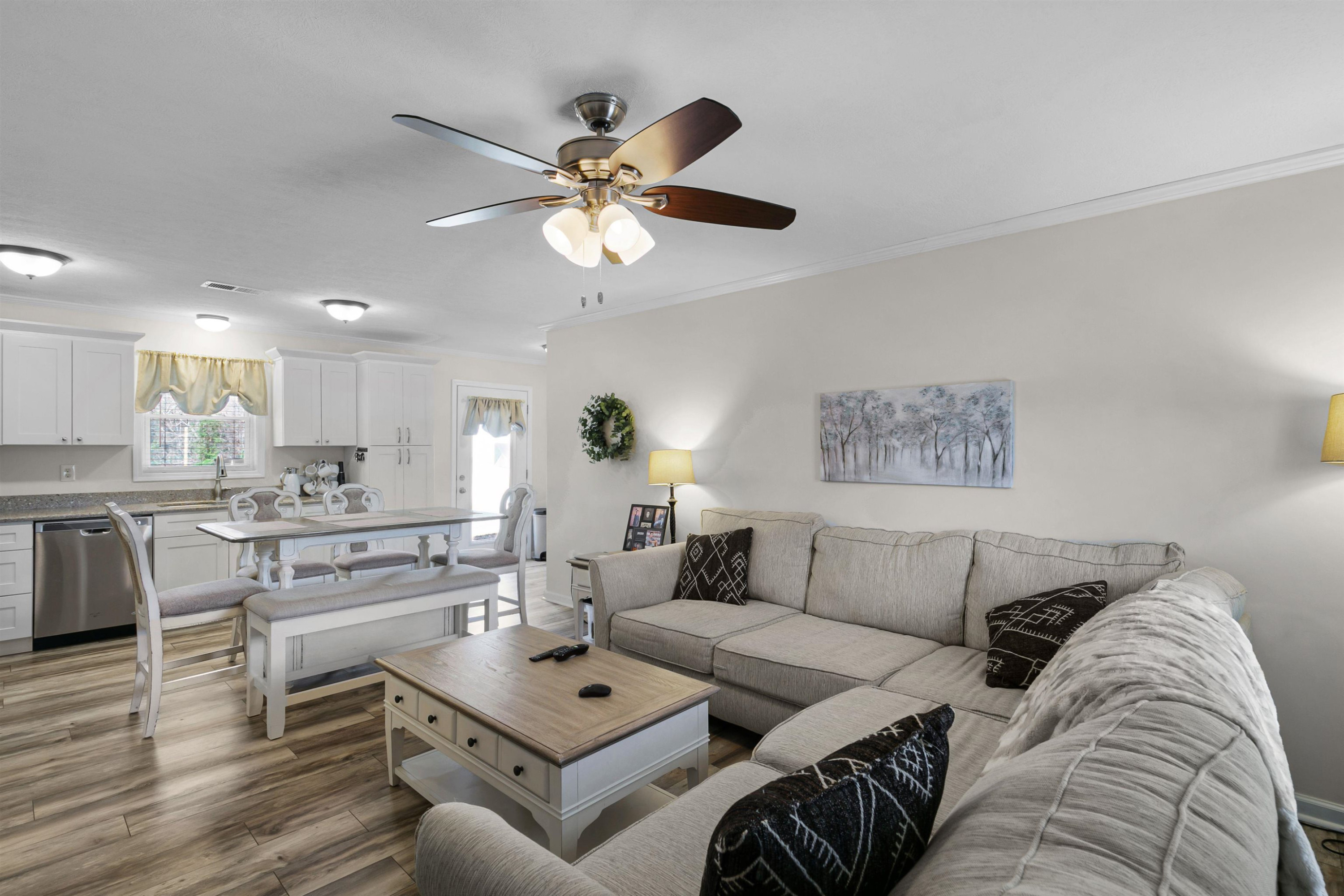 237 Adair Road Jackson, TN 38305 - Photo 4 of 23 a living room with furniture kitchen view and a chandelier