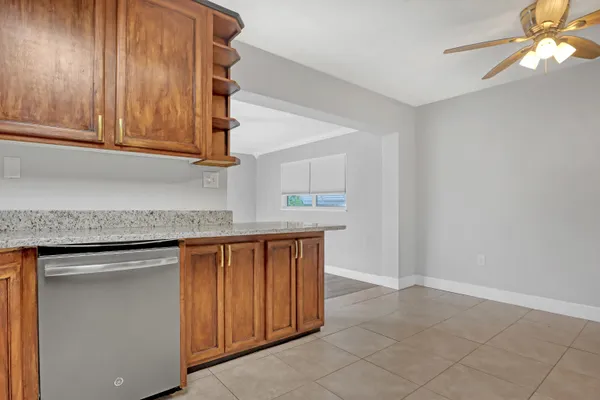a kitchen with stainless steel appliances granite countertop a sink and a cabinets