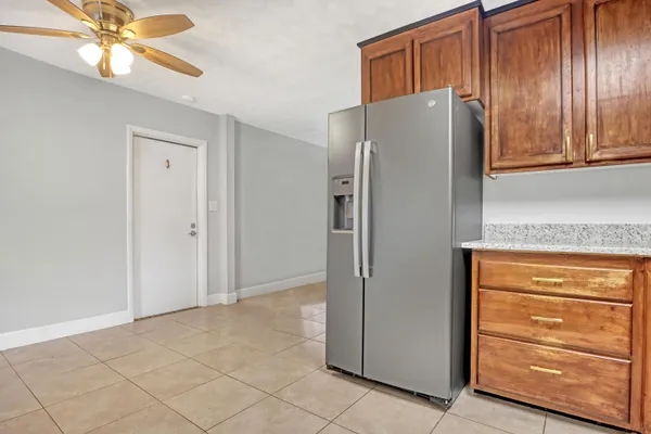 a refrigerator freezer sitting inside of a kitchen