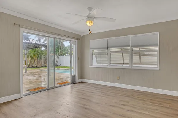a view of an empty room with a window