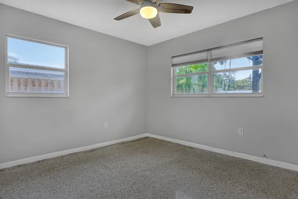 an empty room with closet area