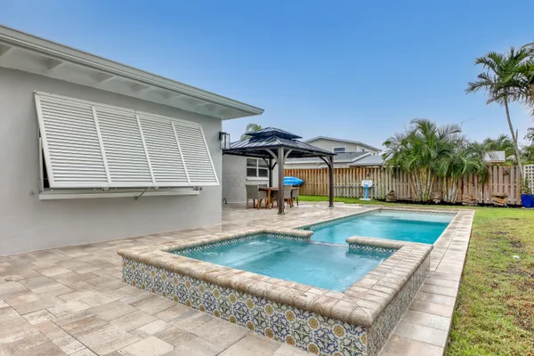 a view of a backyard with a patio