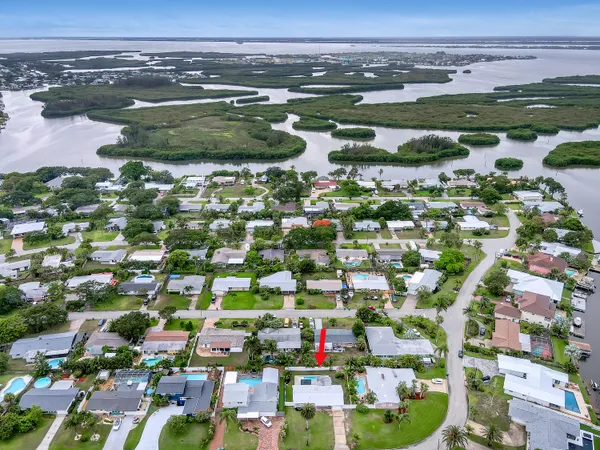 an aerial view of a houses and an outdoor space