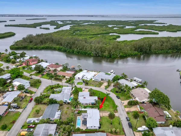 a aerial view of a house with a yard