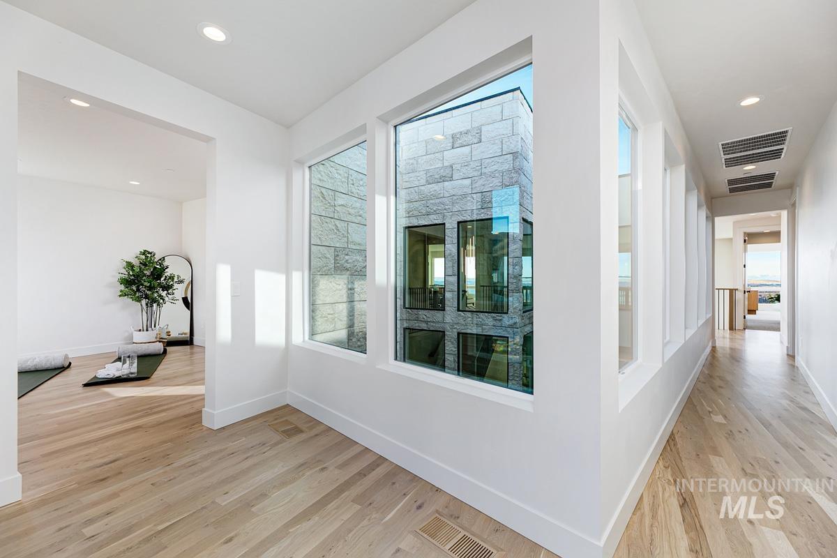 5825 East Prominence Court Boise, ID 83716 - Photo 31 of 45 Hall with recessed lighting and light wood-style flooring