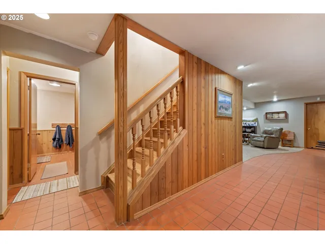 a view of a livingroom with furniture and a hallway