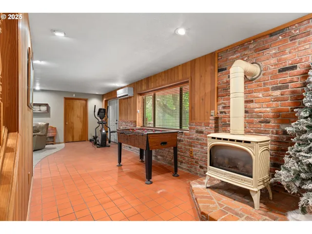 a living room with furniture a window and a fireplace