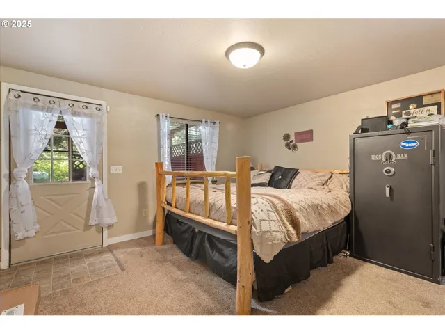 a bed room with a bed and a window