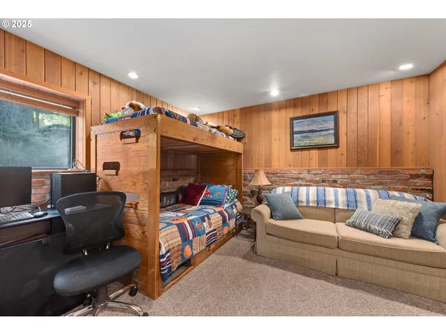 a bedroom with furniture and a window