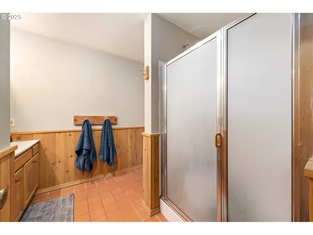 view of walk in closet with clothes and shoes