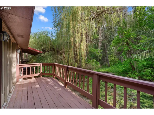 a view of balcony with wooden floor