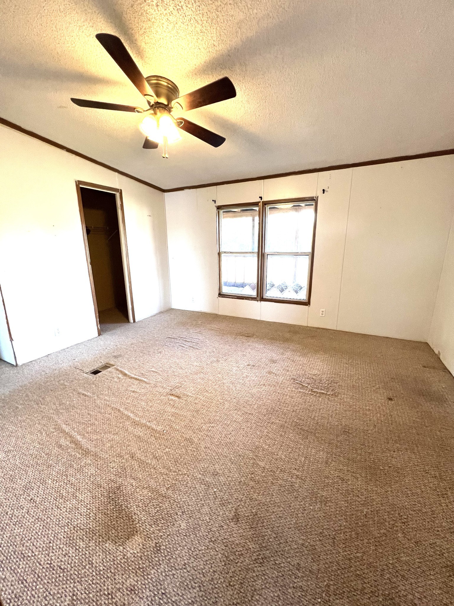 416 Walker Ridge Road Big Rock, TN 37023 - Photo 12 of 25 an empty room with windows and ceiling fan