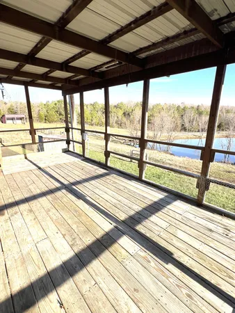 a view of empty space with wooden floor