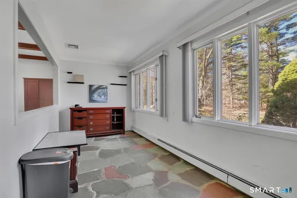 a living room with furniture and a window