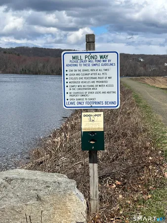 a sign board on the side of a road