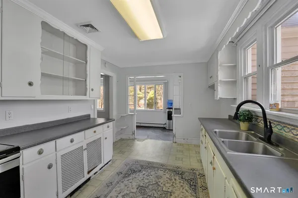 a kitchen with a sink and cabinets