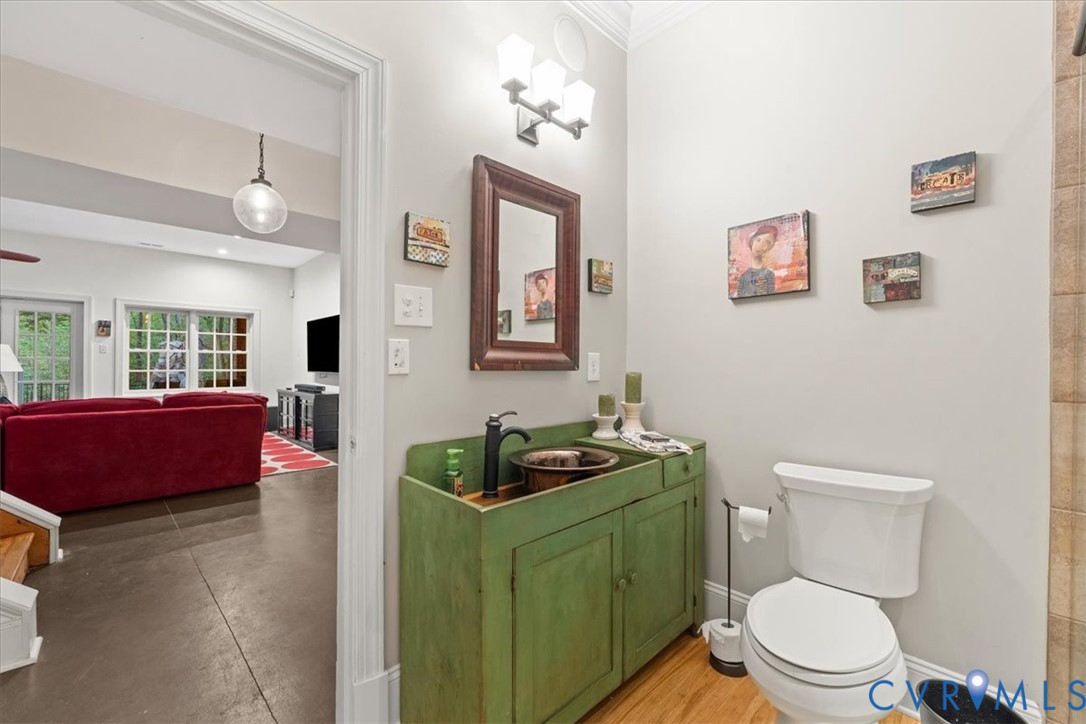 3308 Yarding Way Toano, VA 23168 - Photo 82 of 83 a bathroom with a toilet a sink and a mirror