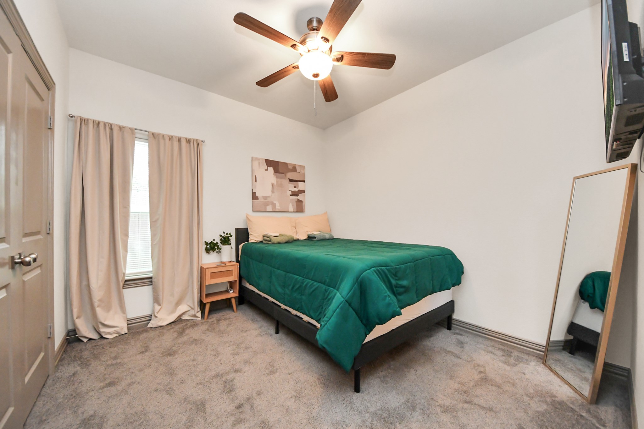 5334 Pershing Street Houston, TX 77033 - Photo 17 of 43 a bedroom with a bed and a window