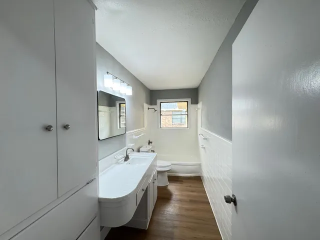 a bathroom with a sink and mirror