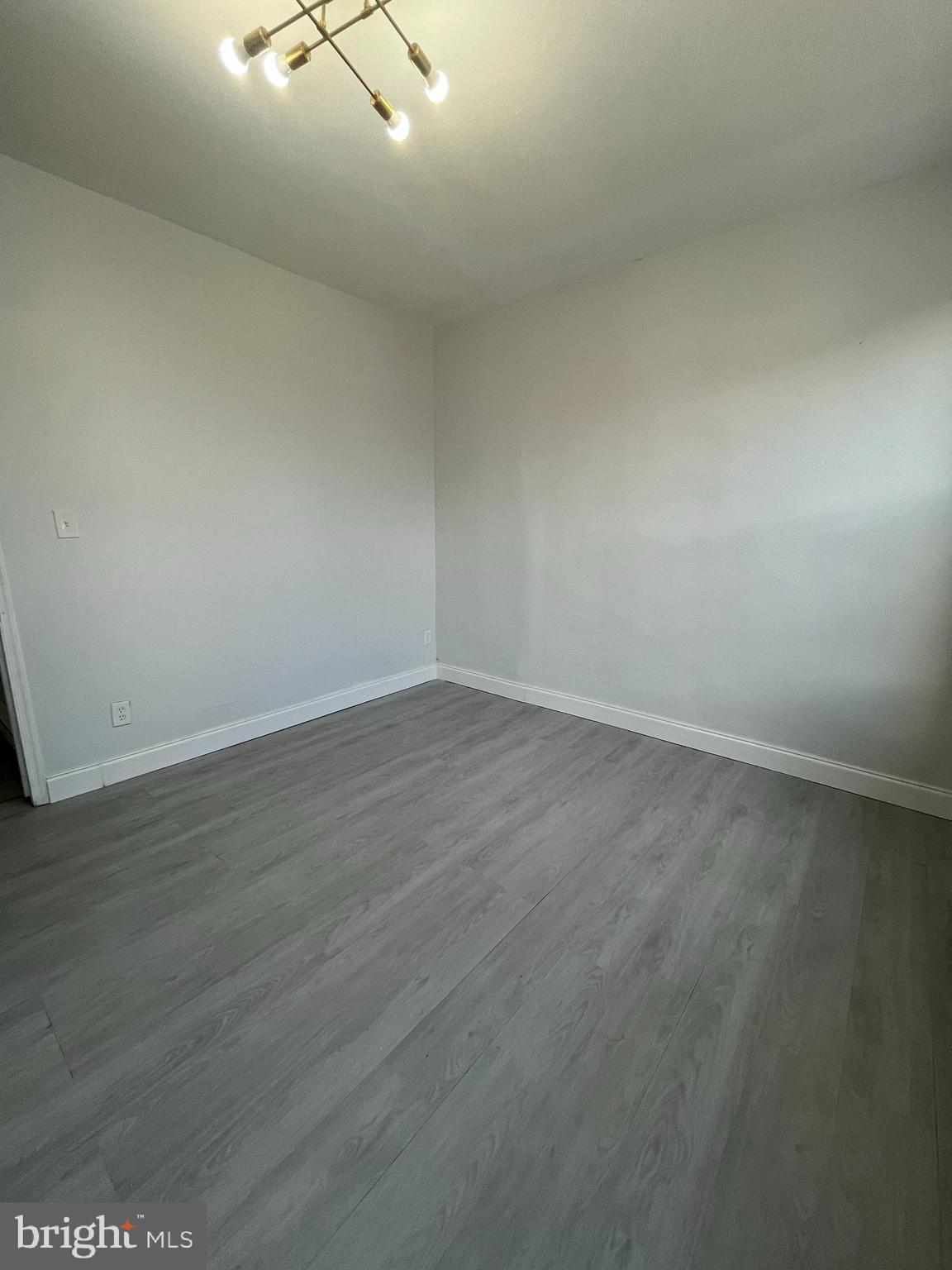 2720 North Hemberger Street Philadelphia, PA 19132 - Photo 12 of 21 an empty room with wooden floor and windows