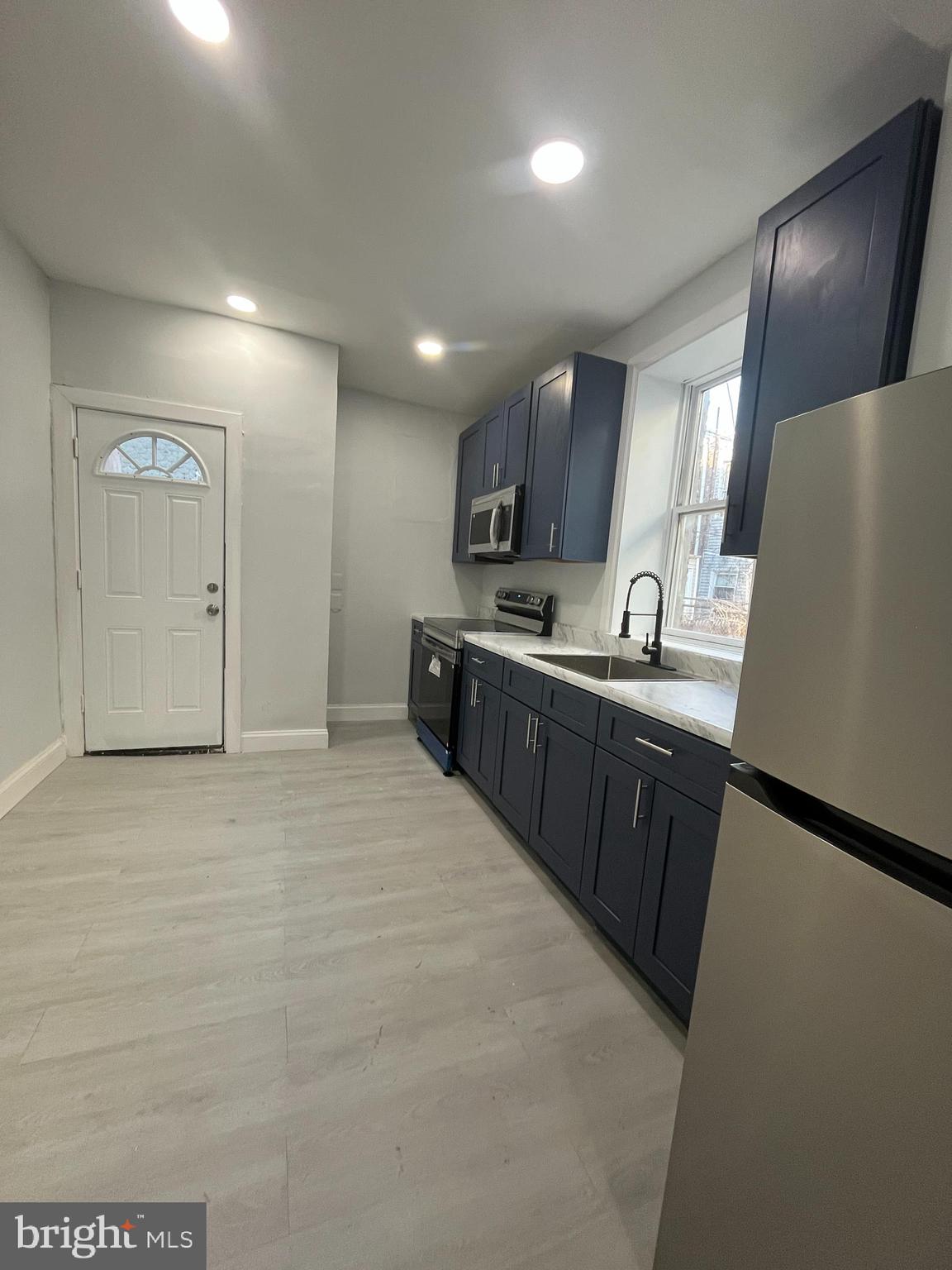 2720 North Hemberger Street Philadelphia, PA 19132 - Photo 4 of 21 a kitchen with stainless steel appliances granite countertop a sink stove and refrigerator