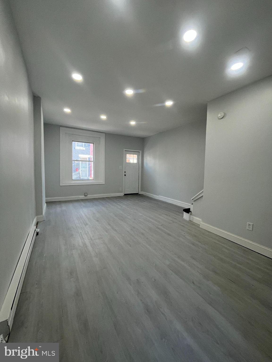 2720 North Hemberger Street Philadelphia, PA 19132 - Photo 6 of 21 an empty room with wooden floor and windows