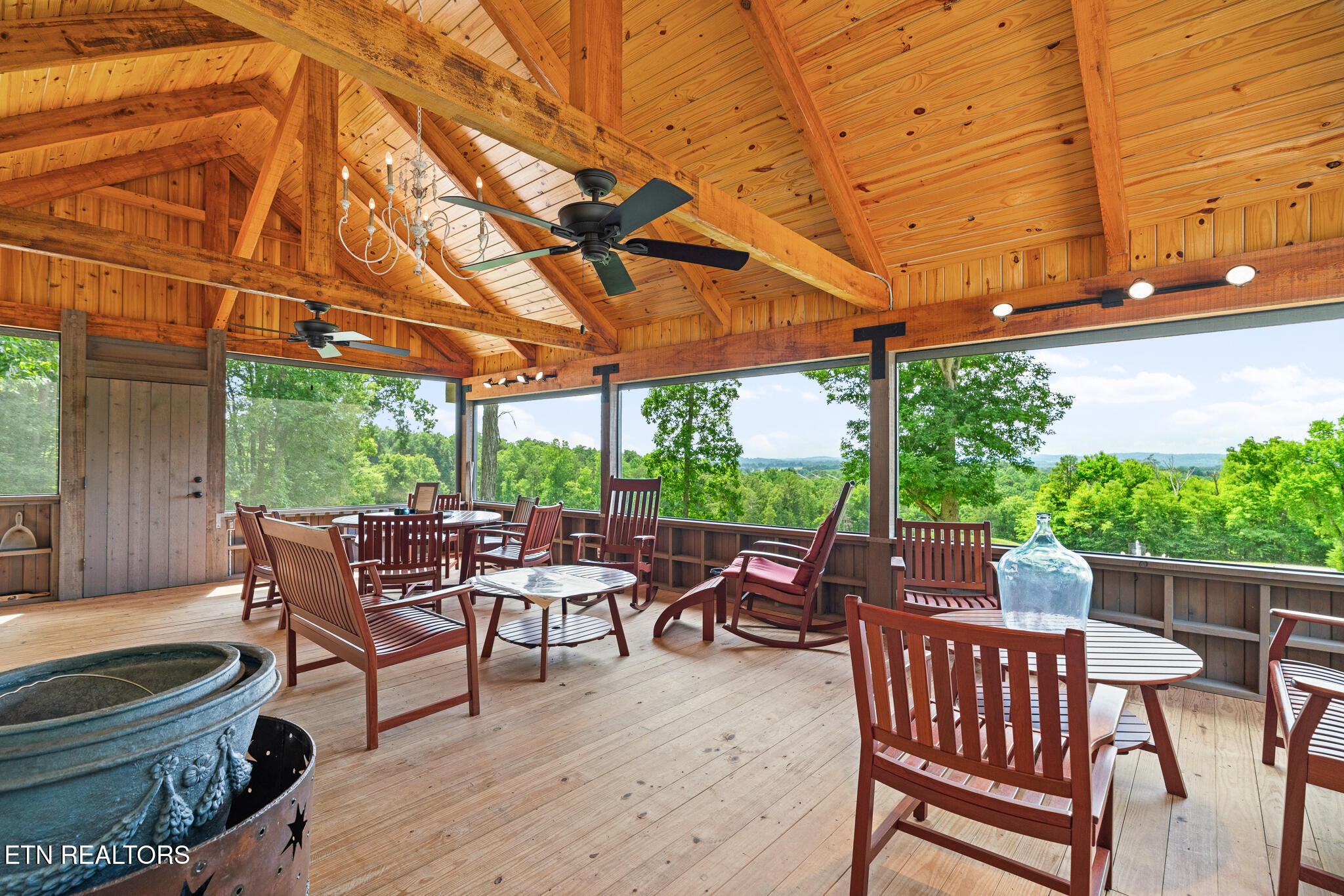 9050 Freeland Road Corryton, TN 37721 - Photo 8 of 34 a view of a patio with a table chairs and a backyard