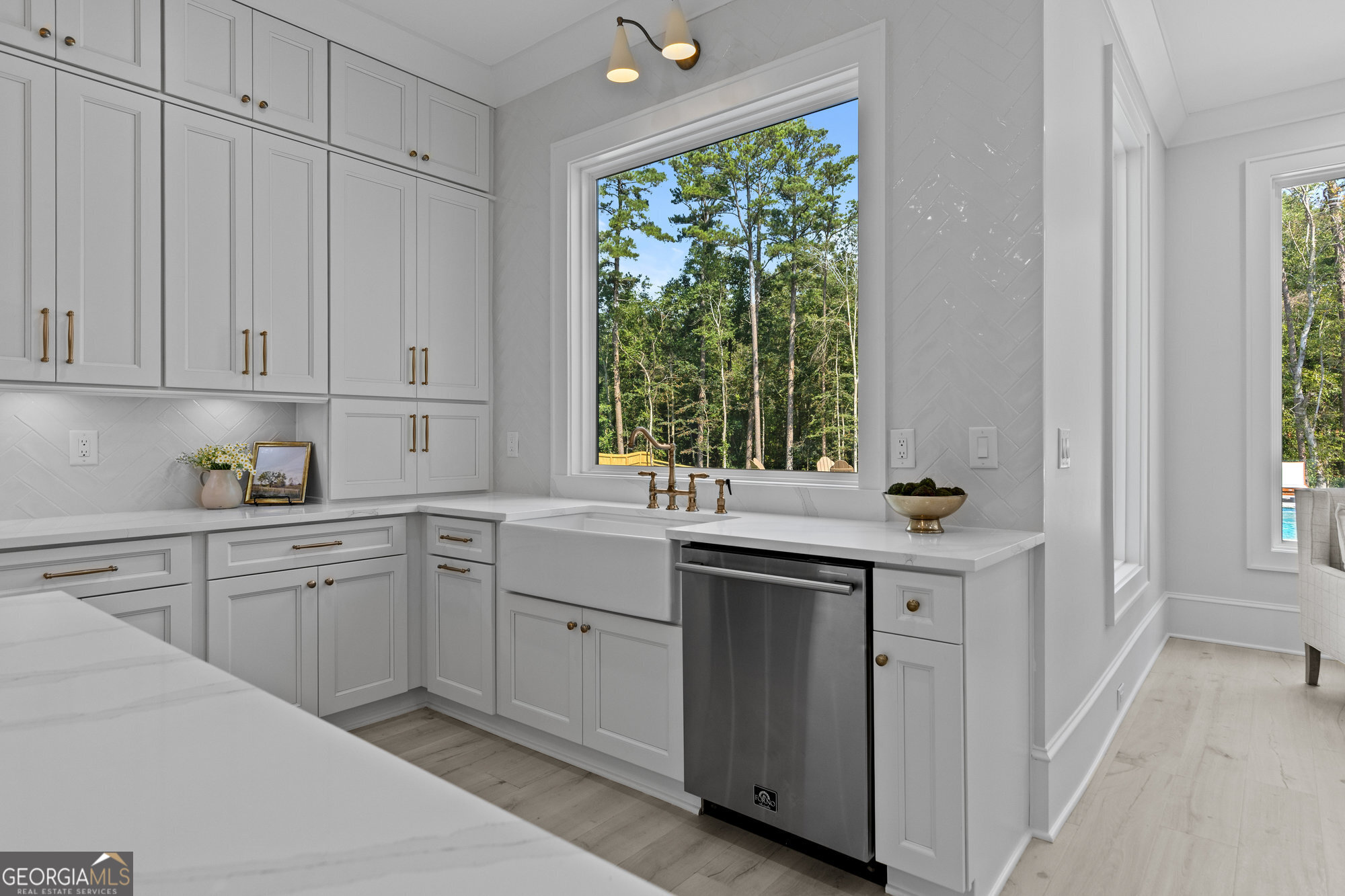 2 Jack Pittman Road Monroe, GA 30019 - Photo 15 of 80 a kitchen with white cabinets and a window