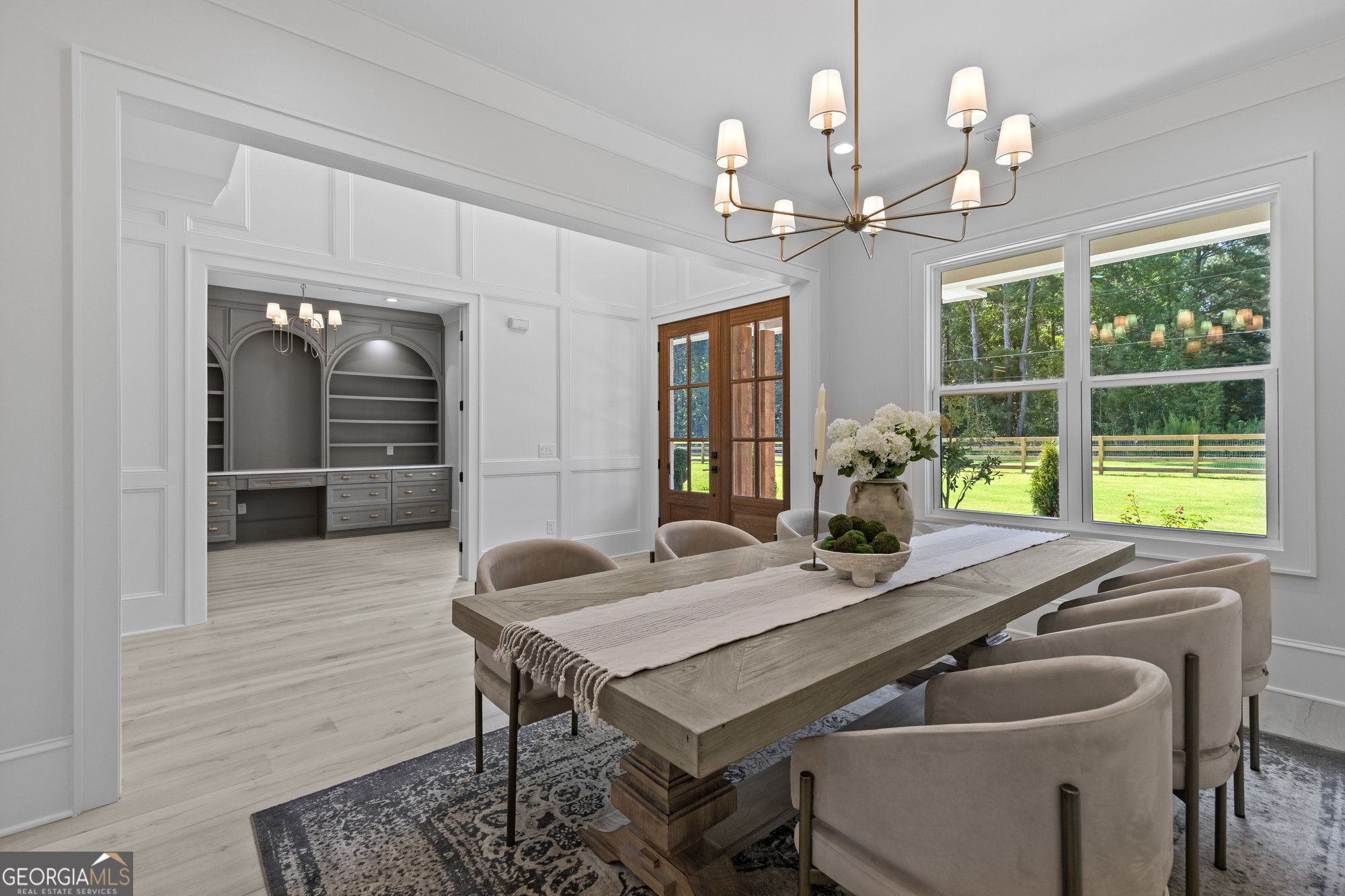 2 Jack Pittman Road Monroe, GA 30019 - Photo 18 of 80 a dining room with wooden floor a chandelier a wooden table and chairs