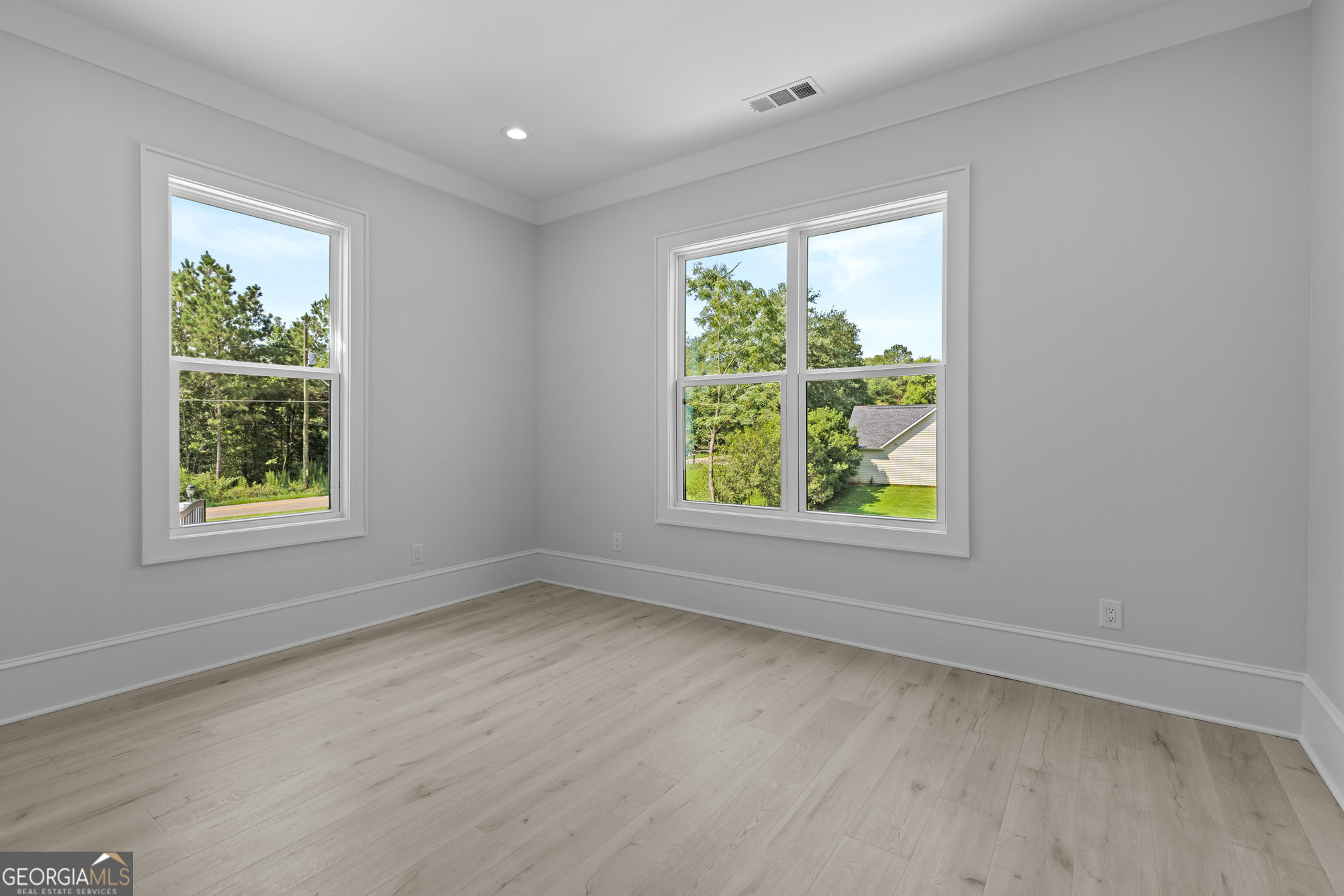 2 Jack Pittman Road Monroe, GA 30019 - Photo 29 of 80 an empty room with wooden floor and windows