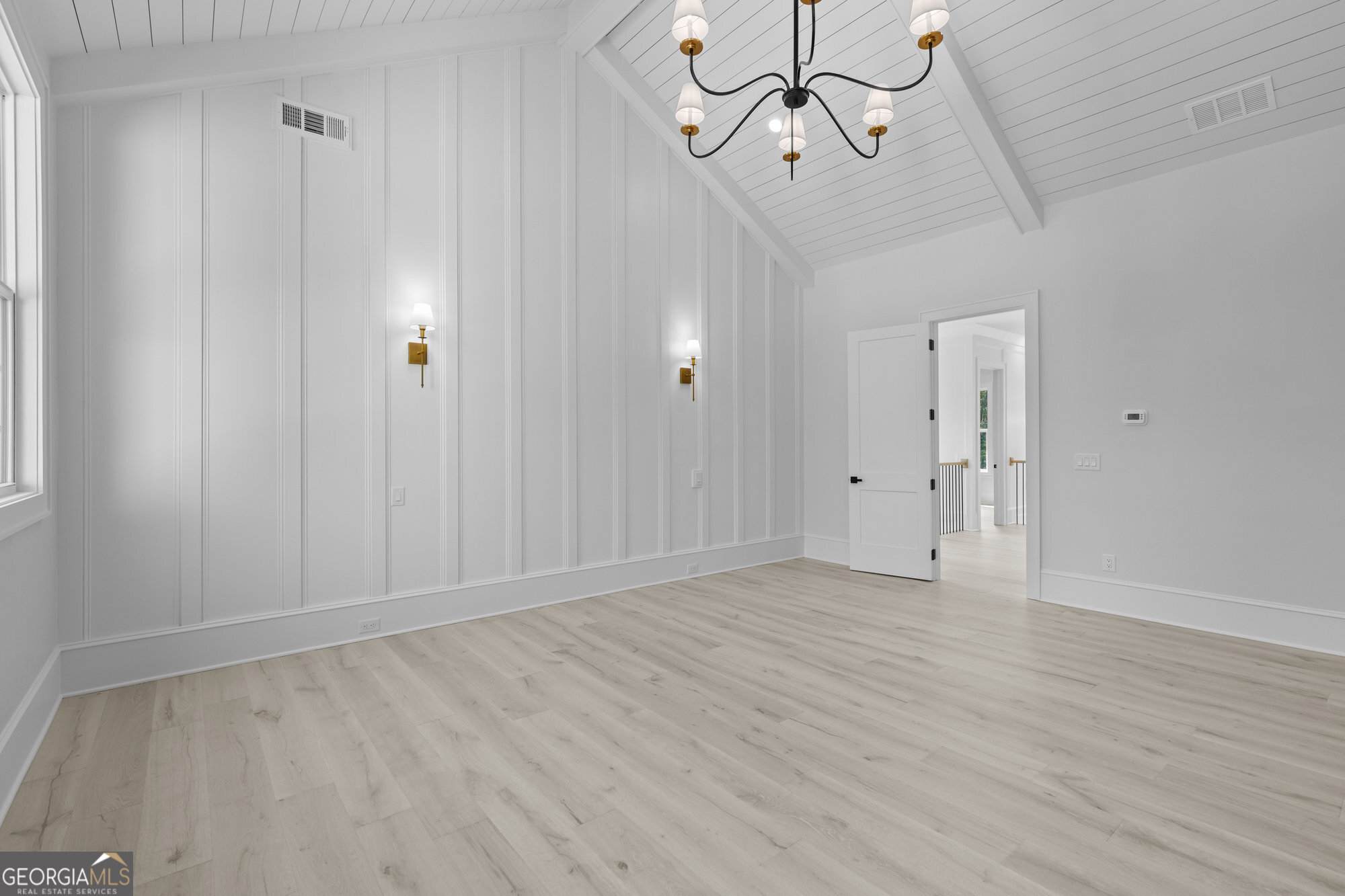 2 Jack Pittman Road Monroe, GA 30019 - Photo 42 of 80 a view of an empty room with chandelier fan and wooden floor