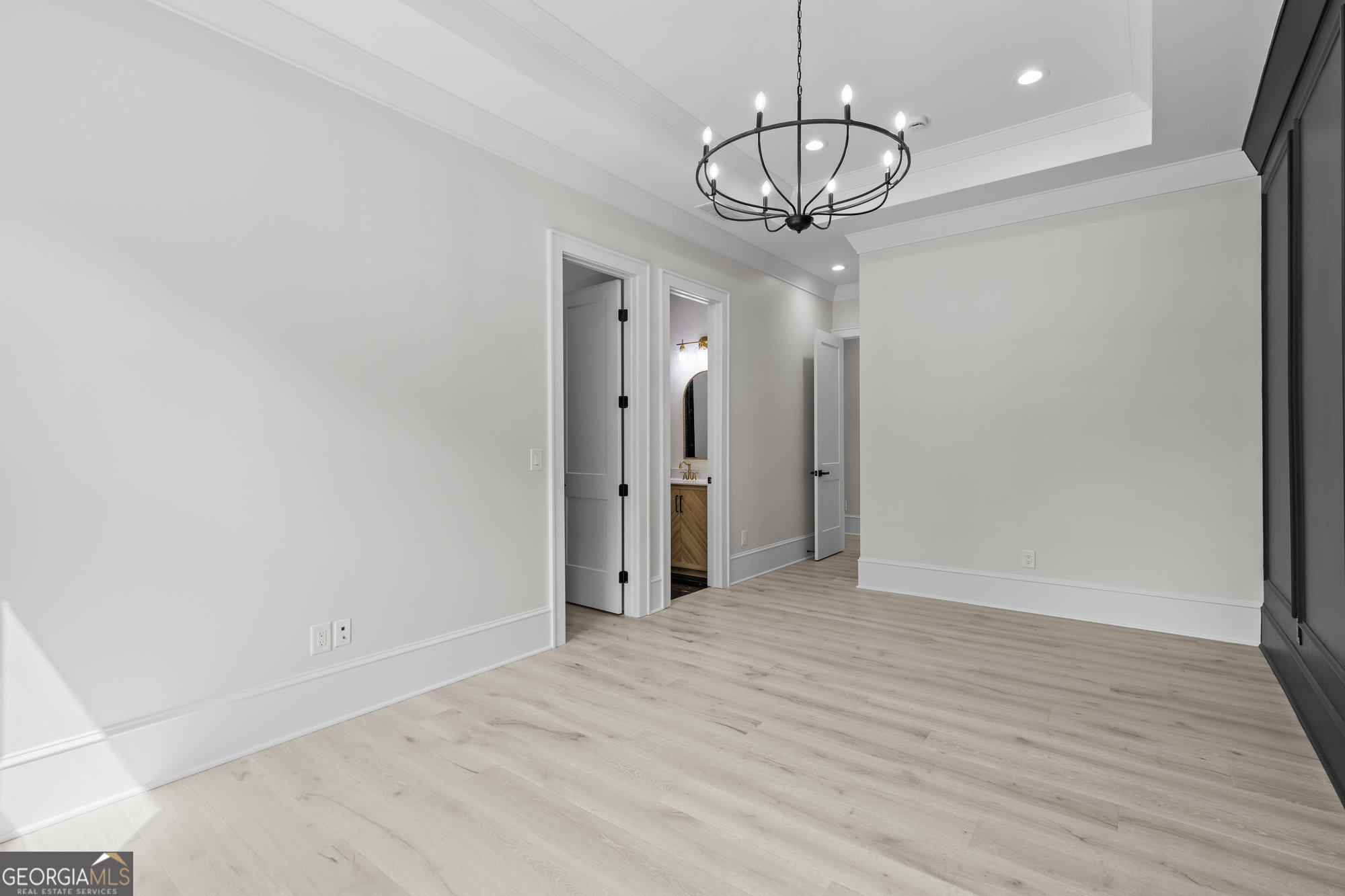 2 Jack Pittman Road Monroe, GA 30019 - Photo 58 of 80 a view of a hallway with wooden floor and chandelier